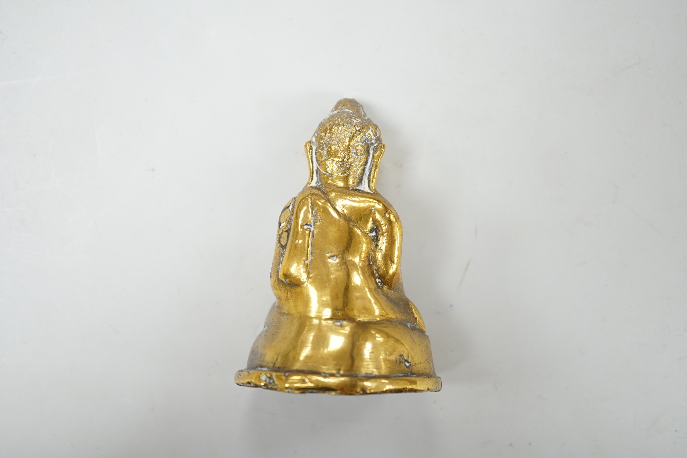 A small cast brass buddha, 8.5cm high